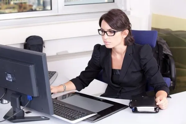 woman performing background checks on employees