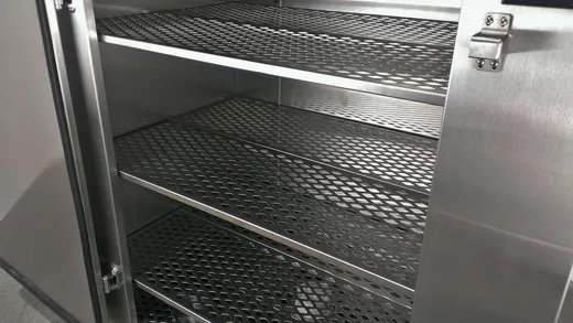 Stainless-steel shelves inside the Fresh Gear ozone sanitizing chamber